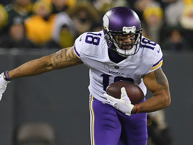 GREEN BAY, WI - DECEMBER 23: Michael Floyd #18 of the Minnesota Vikings is brought down by Josh Jones #27 of the Green Bay Packers during the second quarter of a game at Lambeau Field on December 23, 2017 in Green Bay, Wisconsin.