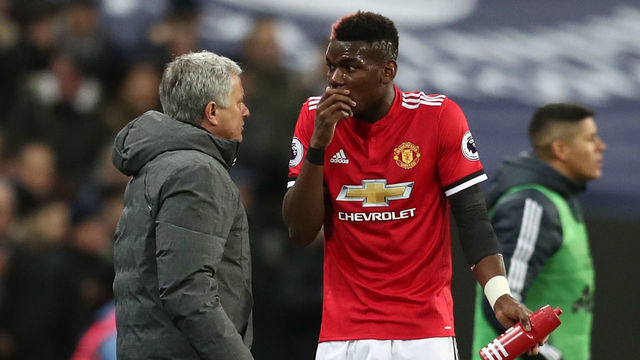 LONDON, ENGLAND - JANUARY 31: Paul Pogba of Manchester United speaks to Jose Mourinho, Manager of Manchester United during the Premier League match between Tottenham Hotspur and Manchester United at Wembley Stadium on January 31, 2018 in London, England.