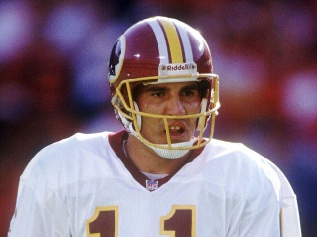 Washington Redskins quarterback Mark Rypien on the field during a game against the Chiefs. Mandatory Credit: Earl Richardson/ALLSPORT