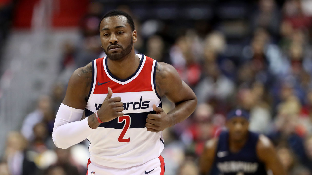 WASHINGTON, DC - DECEMBER 13: John Wall #2 of the Washington Wizards celebrates after hitting a three pointer against the Memphis Grizzlies at Capital One Arena on December 13, 2017 in Washington, DC.