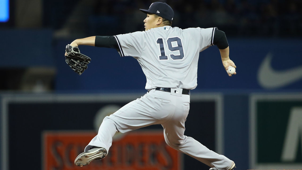 TORONTO, ON - MARCH 30: Masahiro Tanaka #19 of the New York Yankees delivers a pitch in the third inning on Opening Day during MLB game action against the Toronto Blue Jays at Rogers Centre on March 30, 2018 in Toronto, Canada.
