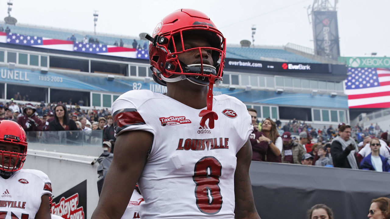 JACKSONVILLE, FL - DECEMBER 30: Lamar Jackson #8 of the Louisville Cardinals takes the field prior to the TaxSlayer Bowl against the Mississippi State Bulldogs at EverBank Field on December 30, 2017 in Jacksonville, Florida.