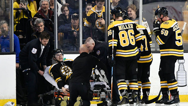 Bruins' Brandon Carlo stretchered off with apparent leg injury