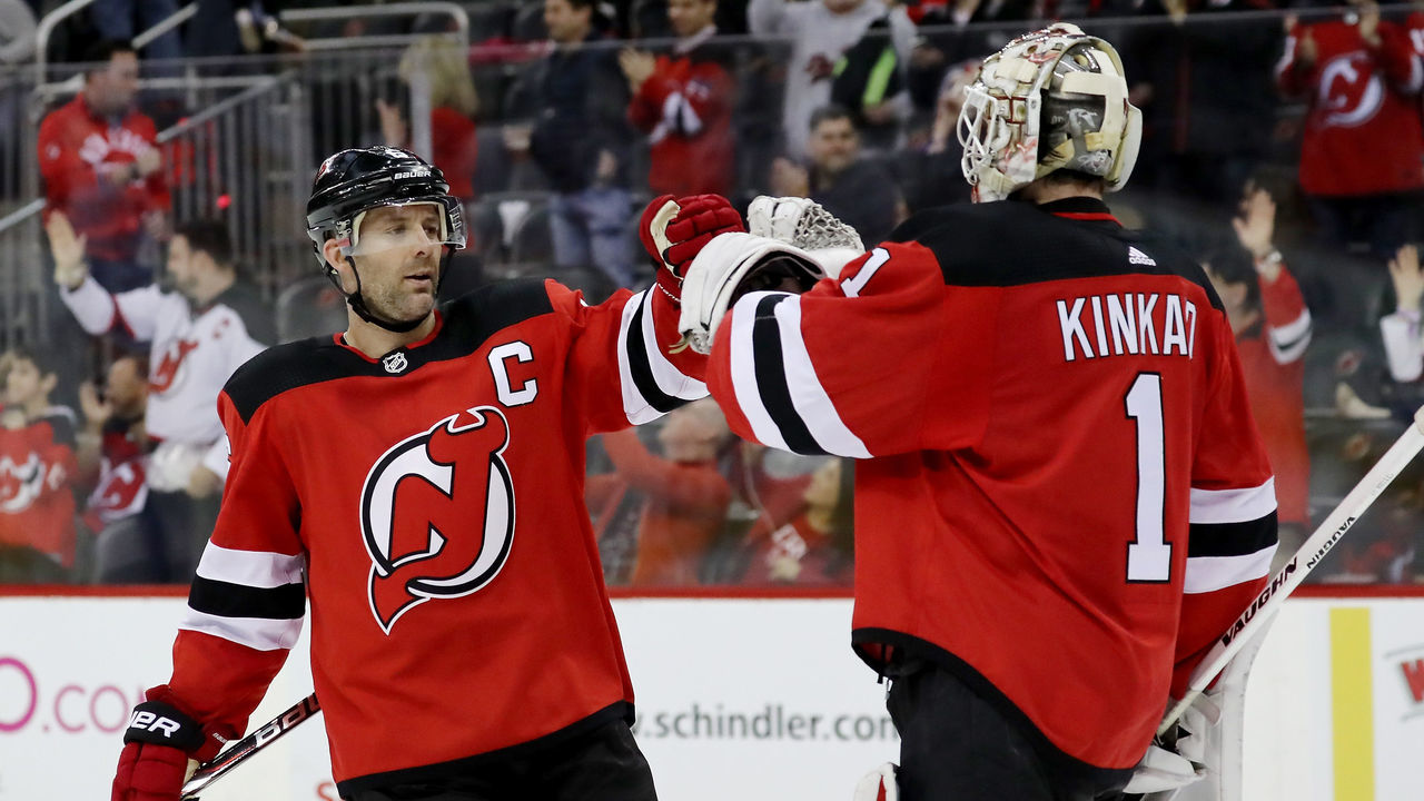 NEWARK, NJ - MARCH 31: Andy Greene #6 of the New Jersey Devils congratulates Keith Kinkaid #1 after the 4-3 win over the New York Islanders on March 31, 2018 at Prudential Center in Newark, New Jersey.