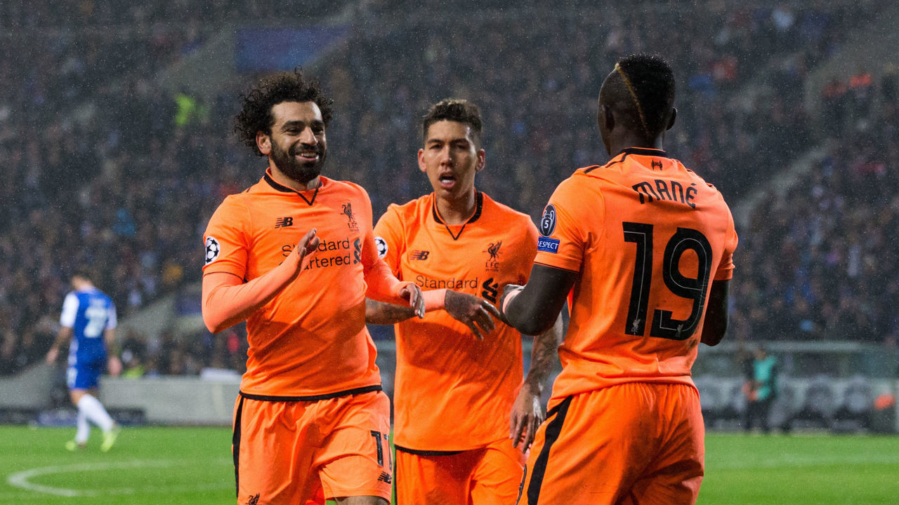 PORTO, PORTUGAL - FEBRUARY 14: Liverpool's Sadio Mane celebrates scoring his side's third goal with team mates Mohamed Salah and Roberto Firmino during the UEFA Champions League Round of 16 First Leg match between FC Porto and Liverpool at Estadio do Dragao on February 14, 2018 in Porto, Portugal.