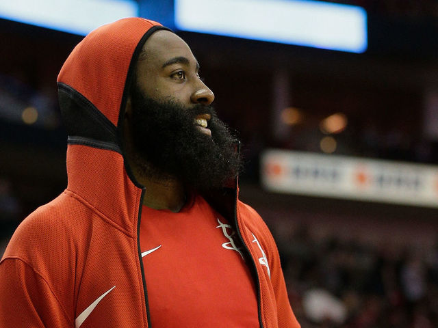 HOUSTON, TX - MARCH 12: James Harden #13 of the Houston Rockets looks on from the sidelines against the San Antonio Spurs at Toyota Center on March 12, 2018 in Houston, Texas.