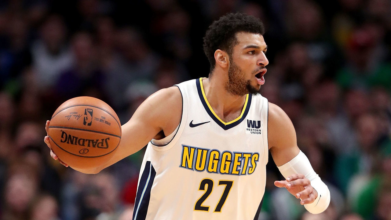 DENVER, CO - JANUARY 29: Jamal Murray #27 of the Denver Nuggets brings the ball down the court against the Boston Celtics at the Pepsi Center on January 29, 2018 in Denver, Colorado.