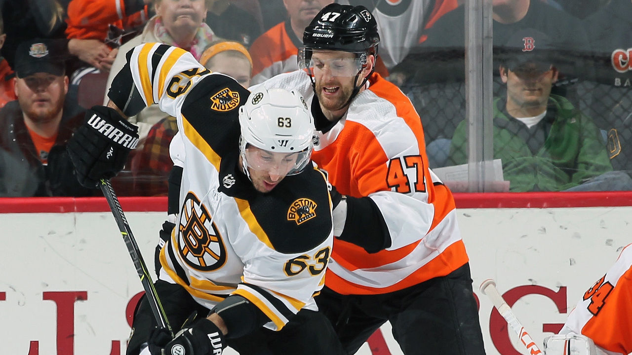 PHILADELPHIA, PA - APRIL 01: Brad Marchand #63 of the Boston Bruins attempts a backhand scoring chance while being defended by Andrew MacDonald #47 of the Philadelphia Flyers on April 1, 2018 at the Wells Fargo Center in Philadelphia, Pennsylvania.