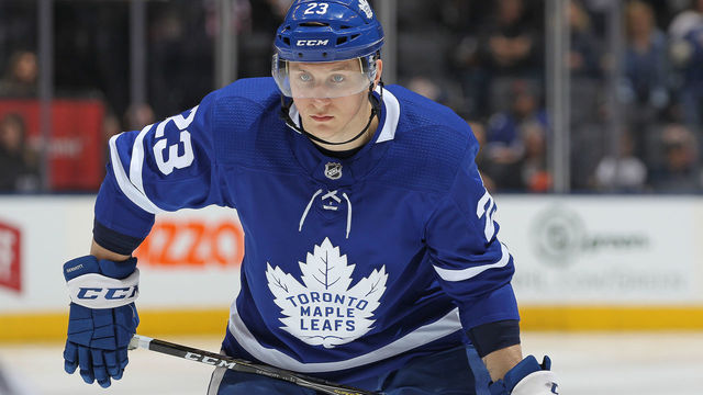 TORONTO, ON - MARCH 24: Travis Dermott #23 of the Toronto Maple Leafs waits for play to resume against the Detroit Red Wings during an NHL game at the Air Canada Centre on March 24, 2018 in Toronto, Ontario, Canada. The Maple Leafs defeated the Red Wings 4-3. *** Local Caption *** Travis Dermott