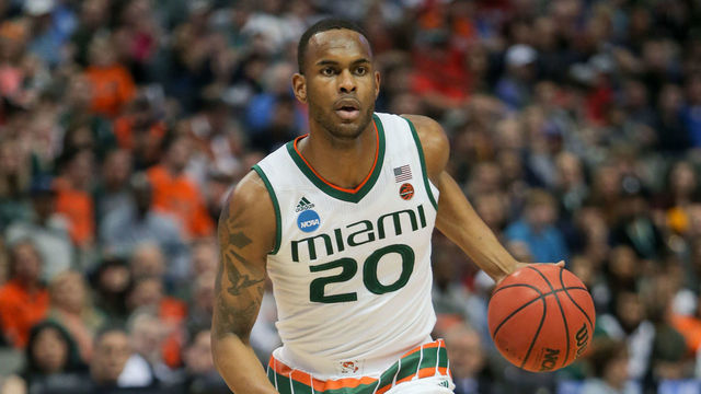 DALLAS, TX - MARCH 15: F Dewan Huell (20) of the Miami Hurricanes brings the ball up the court during the NCAA Div I Men's Championship First Round basketball game between Loyola of Chicago and Miami on March 15, 2018 at American Airlines Center in Dallas, TX.