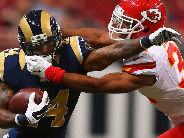 ST. LOUIS, MO - SEPTEMBER 3: Marcus Cooper #31 of the Kansas City Chiefs tackles Isaiah Pead #24 of the St. Louis Rams in the first quarter during a pre-season game at the Edward Jones Dome on September 3, 2014 in St. Louis, Missouri.