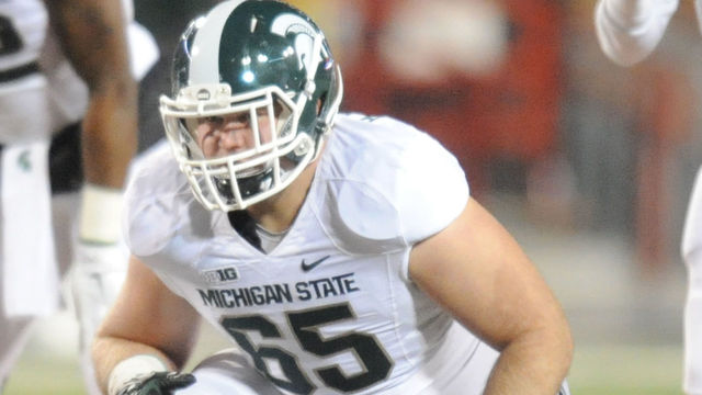 COLLEGE PARK, MD - NOVEMBER 15: Brian Allen #65 of the Michigan State Spartans in position during a college football game against the Maryland Terrapins at Byrd Stadium on November 15, 2014 in College Park, Maryland. The Spartans won 37-15.