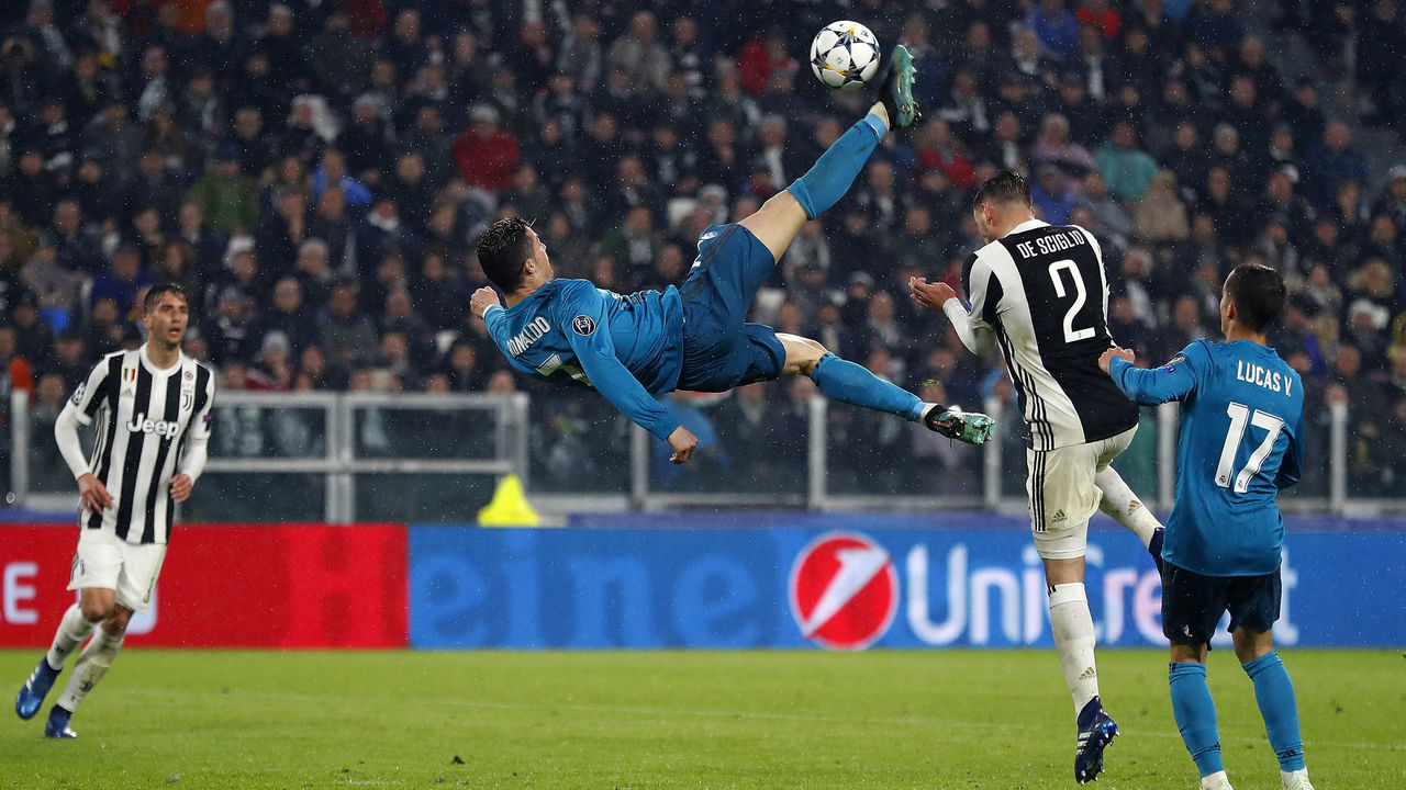 TURIN, ITALY - APRIL 03: Cristiano Ronaldo of Real Madrid scores his team's second goal during the UEFA Champions League Quarter Final Leg One match between Juventus and Real Madrid at Juventus Stadium on April 3, 2018 in Turin, Italy.
