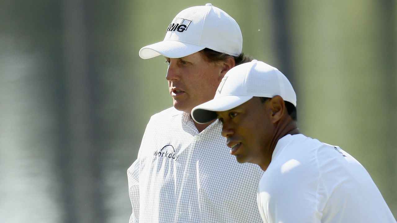 AUGUSTA, GA - APRIL 03: Tiger Woods and Phil Mickelson of the United States talk during a practice round prior to the start of the 2018 Masters Tournament at Augusta National Golf Club on April 3, 2018 in Augusta, Georgia.