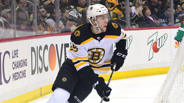 PITTSBURGH, PA - JANUARY 07: Brandon Carlo #25 of the Boston Bruins skates with the puck against the Pittsburgh Penguins at PPG PAINTS Arena on January 7, 2018 in Pittsburgh, Pennsylvania.