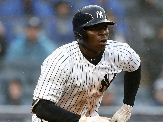 NEW YORK, NY - APRIL 03: Didi Gregorius #18 of the New York Yankees watches his three run home run in the third inning against the Tampa Bay Rays during Opening Day at Yankee Stadium on April 3, 2018 in the Bronx borough of New York City.