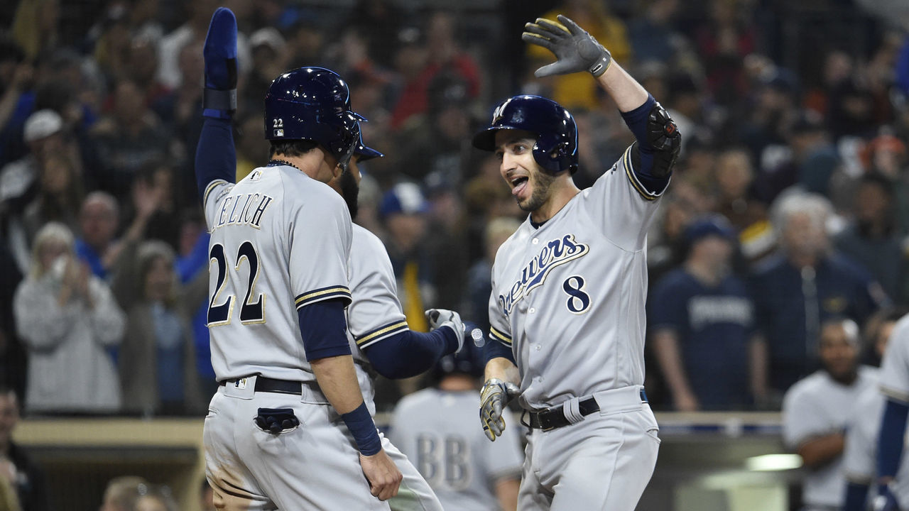 SAN DIEGO, CA - MARCH 30: Ryan Braun #8 of the Milwaukee Brewers is congratulated by Christian Yelich #22 after hitting a three-run home run during the ninth inning of a baseball game against the San Diego Padres at PETCO Park on March 30, 2018 in San Diego, California.