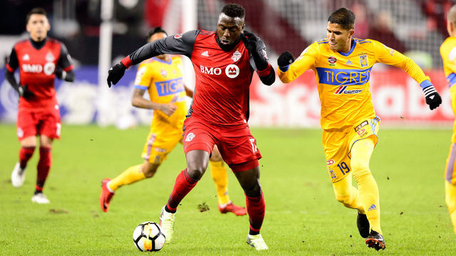 TORONTO, ON - MARCH 07: Jozy Altidore (17) of Toronto FC dribbles the ball away from Larry Vásquez (19) of Tigres UANL during the first half of the CONCACAF Champions League Quarter-final match between Toronto FC and Tigres UANL on March 7, 2018, at BMO Field in Toronto, ON, Canada. (Photograph by Julian Avram/Icon Sportswire via Getty Images)