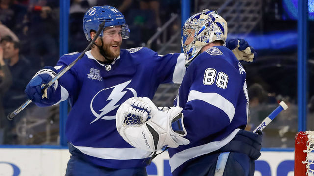 TAMPA, FL - APRIL 3: Victor Hedman #77 celebrates with Andrei Vasilevskiy #88 of the Tampa Bay Lightning after shutting out the Boston Bruins during the third period of the game at the Amalie Arena on April 3, 2018 in Tampa, Florida.