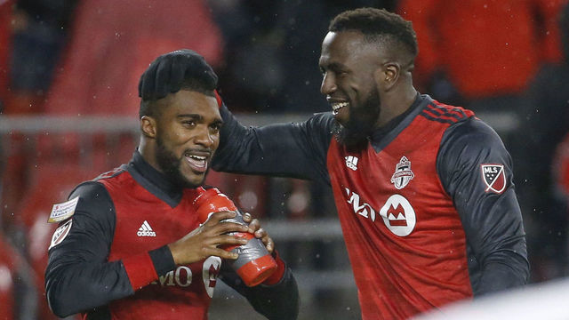 TORONTO, ON - APRIL 3: Toronto FC defender Ashtone Morgan (5) grabs a quick drink and gets a head rub from Toronto FC forward Jozy Altidore (17) after netting the 3rd goal. Toronto FC vs Club America (Mexico) during 2nd half action in CONCACAF semi-final play at BMO Field. TFC won 3-1, taking the first leg of the semi-final. Toronto Star/Rick Madonik (Rick Madonik/Toronto Star via Getty Images)