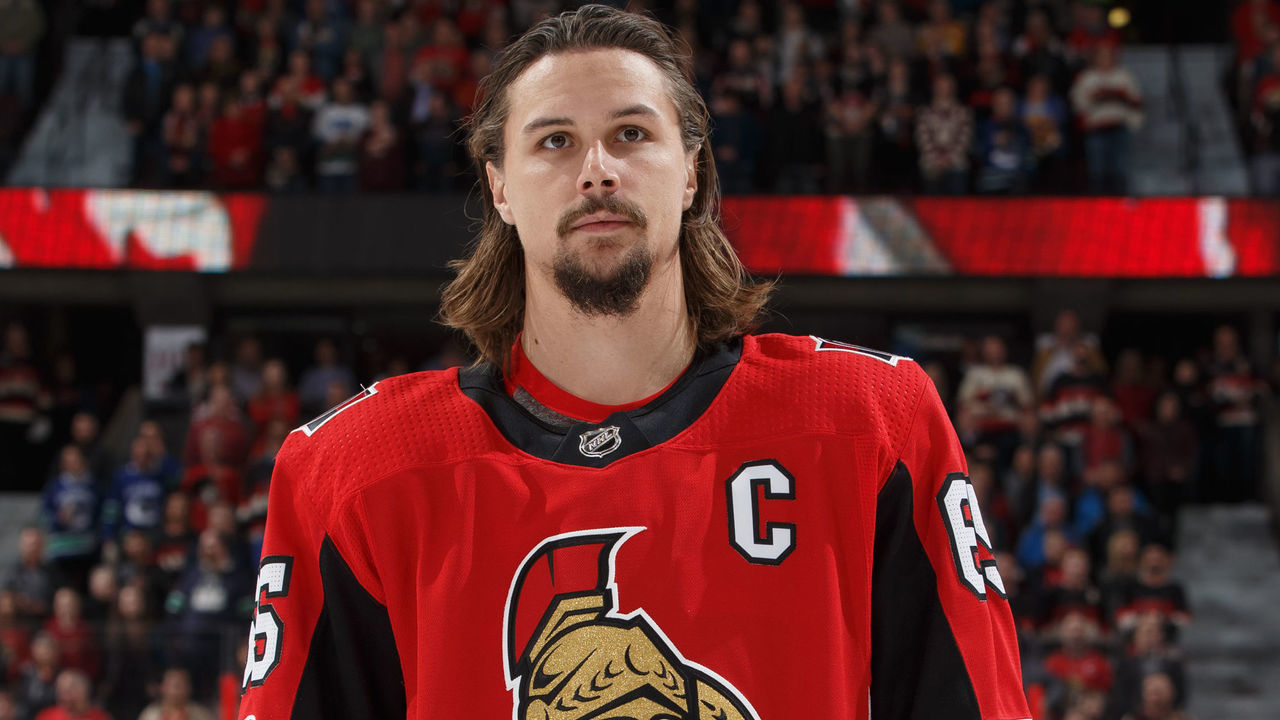 OTTAWA, ON - OCTOBER 17: Erik Karlsson of the Ottawa Senators stands at attention during the singing of the national anthem prior to a game against the Vancouver Canucks at Canadian Tire Centre on October 17, 2017 in Ottawa, Ontario, Canada.