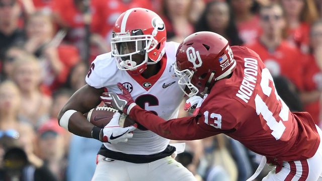 PASADENA, CA - JANUARY 01: Tre Norwood #13 of the Oklahoma Sooners tackles Javon Wims #6 of the Georgia Bulldogs in the 2018 College Football Playoff Semifinal at the Rose Bowl Game presented by Northwestern Mutual at the Rose Bowl on January 1, 2018 in Pasadena, California.