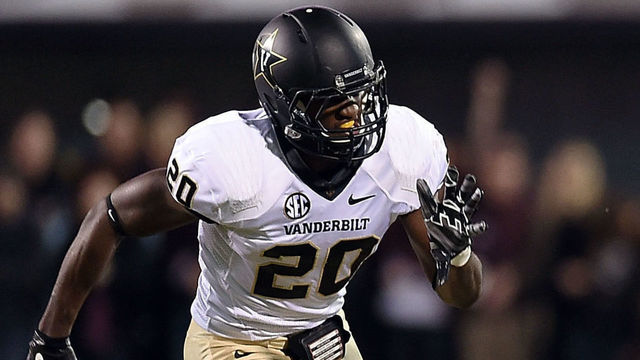 STARKVILLE, MS - NOVEMBER 22: Josh Robinson #13 of the Mississippi State Bulldogs runs past Oren Burks #20 of the Vanderbilt Commodores during the second quarter of a game at Davis Wade Stadium on November 22, 2014 in Starkville, Mississippi.