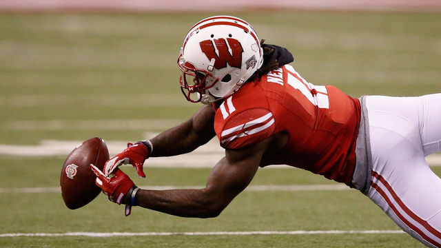 INDIANAPOLIS, IN - DECEMBER 02: Cornerback Nick Nelson #11 of the Wisconsin Badgers reaches for an incomplete pass against the Ohio State Buckeyes during the Big Ten Championship game at Lucas Oil Stadium on December 2, 2017 in Indianapolis, Indiana.