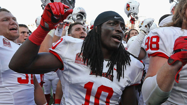 EVANSTON, IL - SEPTEMBER 10: (L-R) Bryce Holm #31, Davontae Harris #10 and Dalton Keene #98 of the Illinois State Redbirds celebrate after a win against the Northwestern Wildcats at Ryan Field on September 10, 2016 in Evanston, Illinois. Illiinois State defeated Northwestern 9-7.