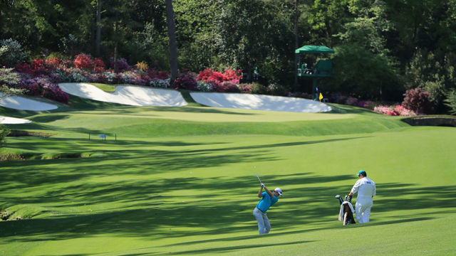AUGUSTA, GA - APRIL 03: Justin Rose of England plays a shot on the 13th hole as caddie Mark Fulcher looks on during a practice round prior to the start of the 2018 Masters Tournament at Augusta National Golf Club on April 3, 2018 in Augusta, Georgia.
