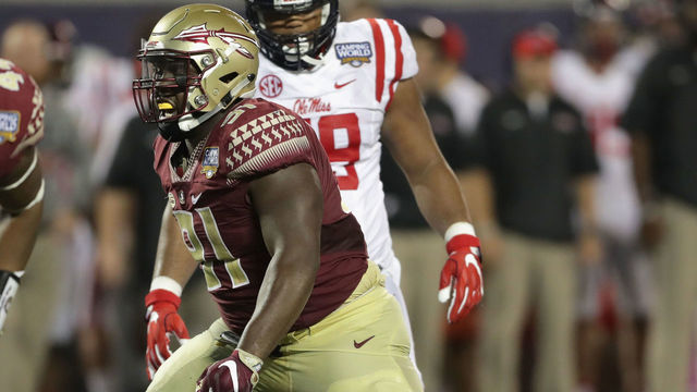 ORLANDO, FL - SEPTEMBER 05: Derrick Nnadi #91 of the Florida State Seminoles steps over Chad Kelly #10 of the Mississippi Rebels in the second half during the Camping World Kickoff at Camping World Stadium on September 5, 2016 in Orlando, Florida.