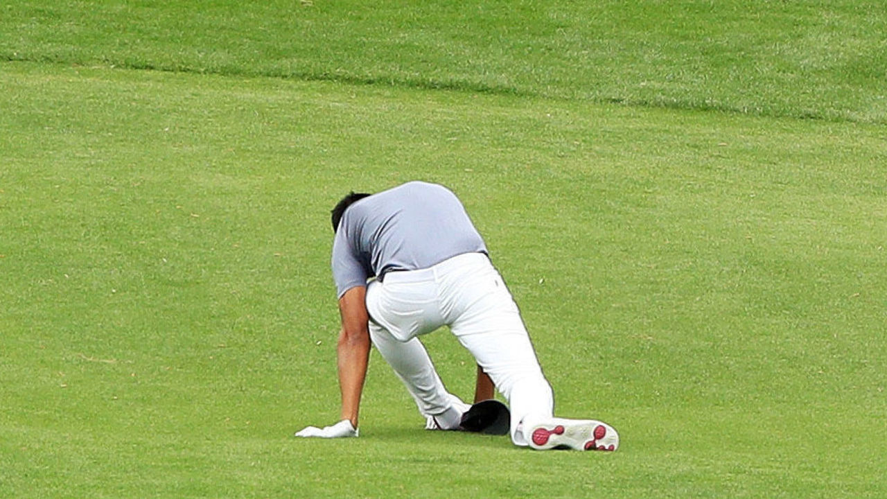 AUGUSTA, GA - APRIL 04: Tony Finau of the United States falls after rolling his ankle while celebrating his hole-in-one on the seventh hole during the Par 3 Contest prior to the start of the 2018 Masters Tournament at Augusta National Golf Club on April 4, 2018 in Augusta, Georgia.