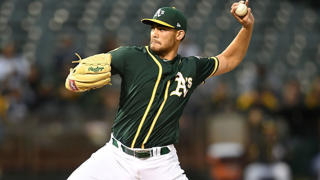 OAKLAND, CA - APRIL 04: Sean Manaea #55 of the Oakland Athletics pitches against the Texas Rangers in the top of the first inning at the Oakland Alameda Coliseum on April 4, 2018 in Oakland, California.