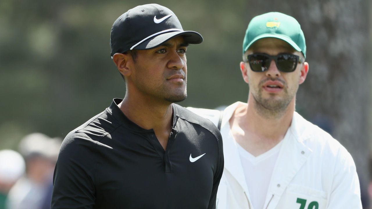 AUGUSTA, GA - APRIL 03: Tony Finau of the United States walks with caddie Greg Bodine during a practice round prior to the start of the 2018 Masters Tournament at Augusta National Golf Club on April 3, 2018 in Augusta, Georgia.