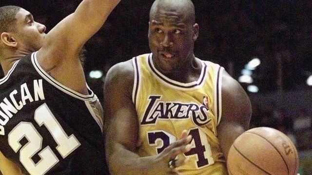 INGLEWOOD, UNITED STATES: Los Angeles Laker Shaquille O'Neal (R) tries to drive past San Antonio Spur Tim Duncan (L) during 1st quarter action in the Western Conference Semi-finals 23 May, 1999 in Inglewood, California. (ELECTRONIC IMAGE) AFP PHOTO Mike NELSON