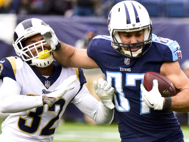NASHVILLE, TN - DECEMBER 24: Wide Receiver Eric Decker #87 of the Tennessee Titans carries the ball against Corner Back Troy Hill #32 of the Los Angeles Rams at Nissan Stadium on December 24, 2017 in Nashville, Tennessee.
