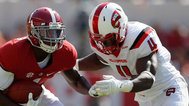 TUSCALOOSA, AL - SEPTEMBER 10: Robert Foster #1 of the Alabama Crimson Tide breaks away from Leverick Johnson #29 of the Western Kentucky Hilltoppers just before getting tackled by Joel Iyiegbuniwe #4 of the Western Kentucky Hilltoppers at Bryant-Denny Stadium on September 10, 2016 in Tuscaloosa, Alabama.