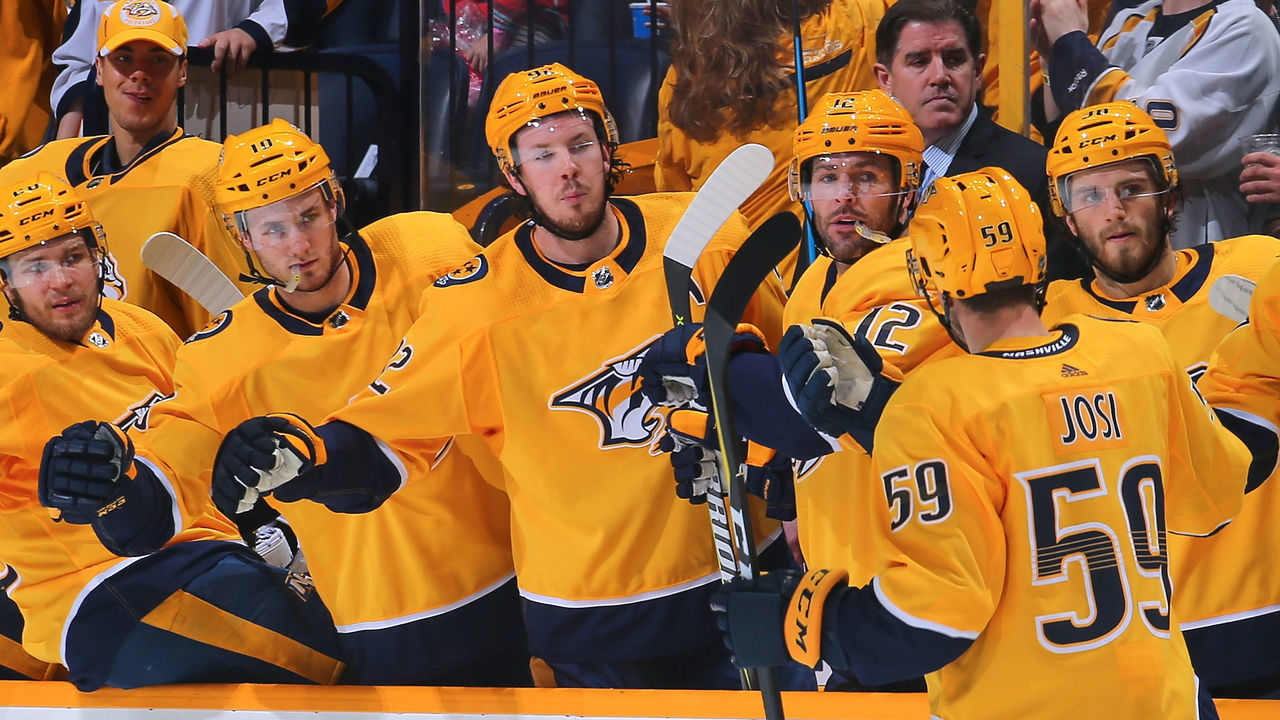 NASHVILLE, TN - MARCH 27: Colton Sissons #10, Ryan Johansen #92, and Mike Fisher #12 of the Nashville Predators congratulate teammate Roman Josi #59 on scoring a goal against the Minnesota Wild during the first period at Bridgestone Arena on March 27, 2018 in Nashville, Tennessee.