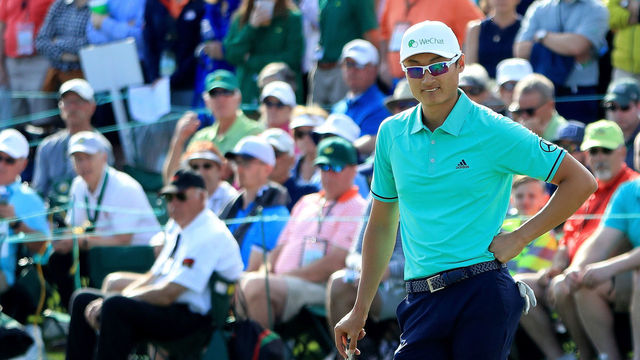 AUGUSTA, GA - APRIL 05: Haotong Li of China waits on the 18th green during the first round of the 2018 Masters Tournament at Augusta National Golf Club on April 5, 2018 in Augusta, Georgia.