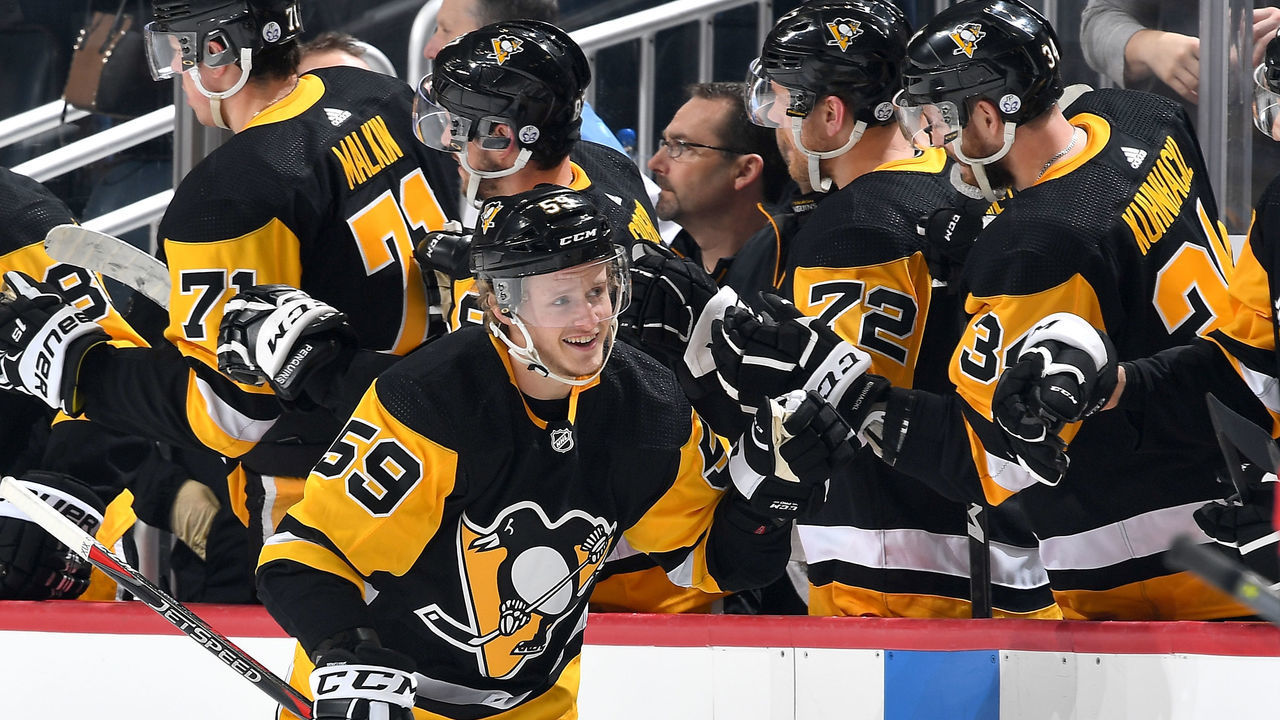 PITTSBURGH, PA - APRIL 06: Jake Guentzel #59 of the Pittsburgh Penguins celebrates his second period goal against the Ottawa Senators at PPG Paints Arena on April 6, 2018 in Pittsburgh, Pennsylvania.
