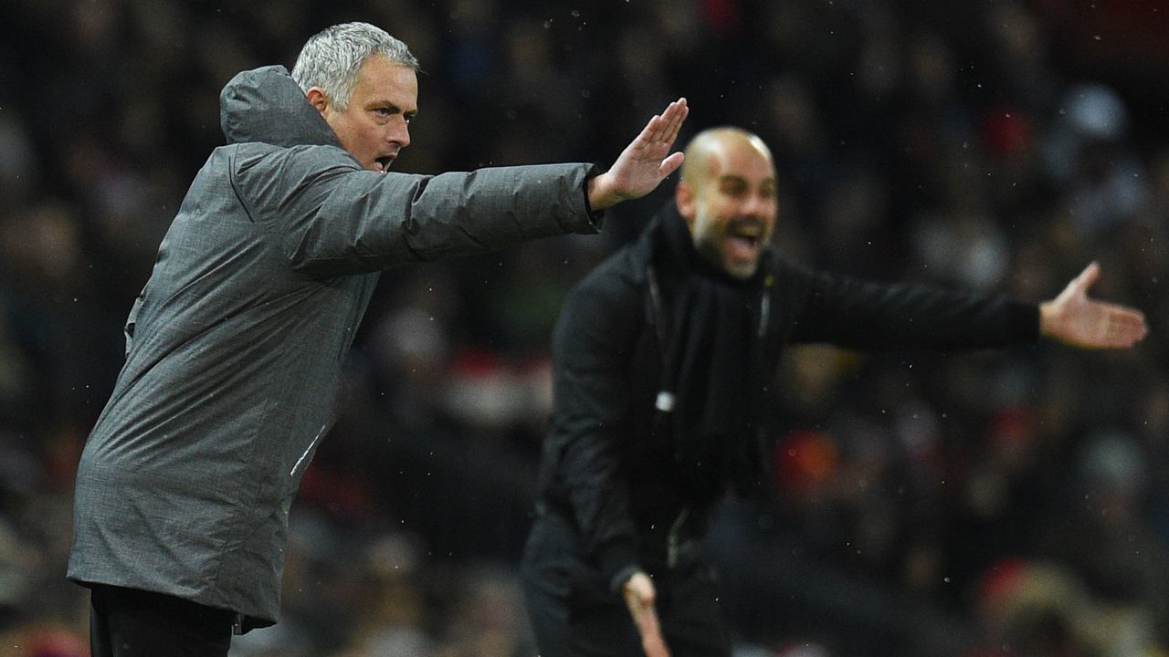 Manchester United's Portuguese manager Jose Mourinho (L) and Manchester City's Spanish manager Pep Guardiola (R) gestures from the touchline during the English Premier League football match between Manchester United and Manchester City at Old Trafford in Manchester, north west England, on December 10, 2017. / AFP PHOTO / Oli SCARFF /