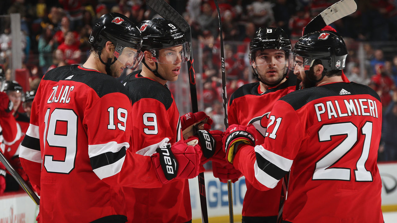 NEWARK, NJ - MARCH 29: (l-r) Travis Zajac #19, Taylor Hall #9, Will Butcher #8 and Kyle Palmieri #21 of the New Jersey Devils celebrate a powerplay goal by Hall at 14:41 of the second period at the Prudential Center on March 29, 2018 in Newark, New Jersey.