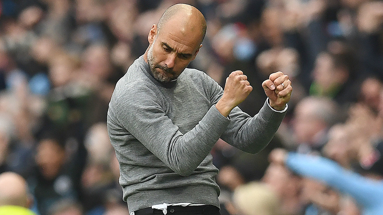 Manchester City's Spanish manager Pep Guardiola celebrates Manchester City's German midfielder Ilkay Gundogan (unseen) scored the second goal during the English Premier League football match between Manchester City and Manchester United at the Etihad Stadium in Manchester, north west England, on April 7, 2018. / AFP PHOTO / Paul ELLIS /