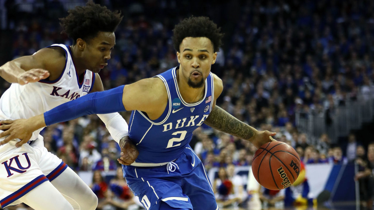 OMAHA, NE - MARCH 25: Gary Trent Jr. #2 of the Duke Blue Devils is defended by Devonte' Graham #4 of the Kansas Jayhawks during the second half in the 2018 NCAA Men's Basketball Tournament Midwest Regional at CenturyLink Center on March 25, 2018 in Omaha, Nebraska.