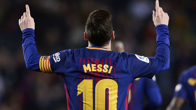 Barcelona's Argentinian forward Lionel Messi celebrates after scoring a goal during the Spanish league football match between Barcelona and Leganes at the Camp Nou stadium in Barcelona on April 7, 2018. / AFP PHOTO / Josep LAGO