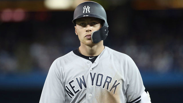 TORONTO, ON - MARCH 31: Brandon Drury #29 of the New York Yankees heads back to the dugout after lining out in the ninth inning during MLB game action against the Toronto Blue Jays at Rogers Centre on March 31, 2018 in Toronto, Canada. *** Local Caption *** Brandon Drury