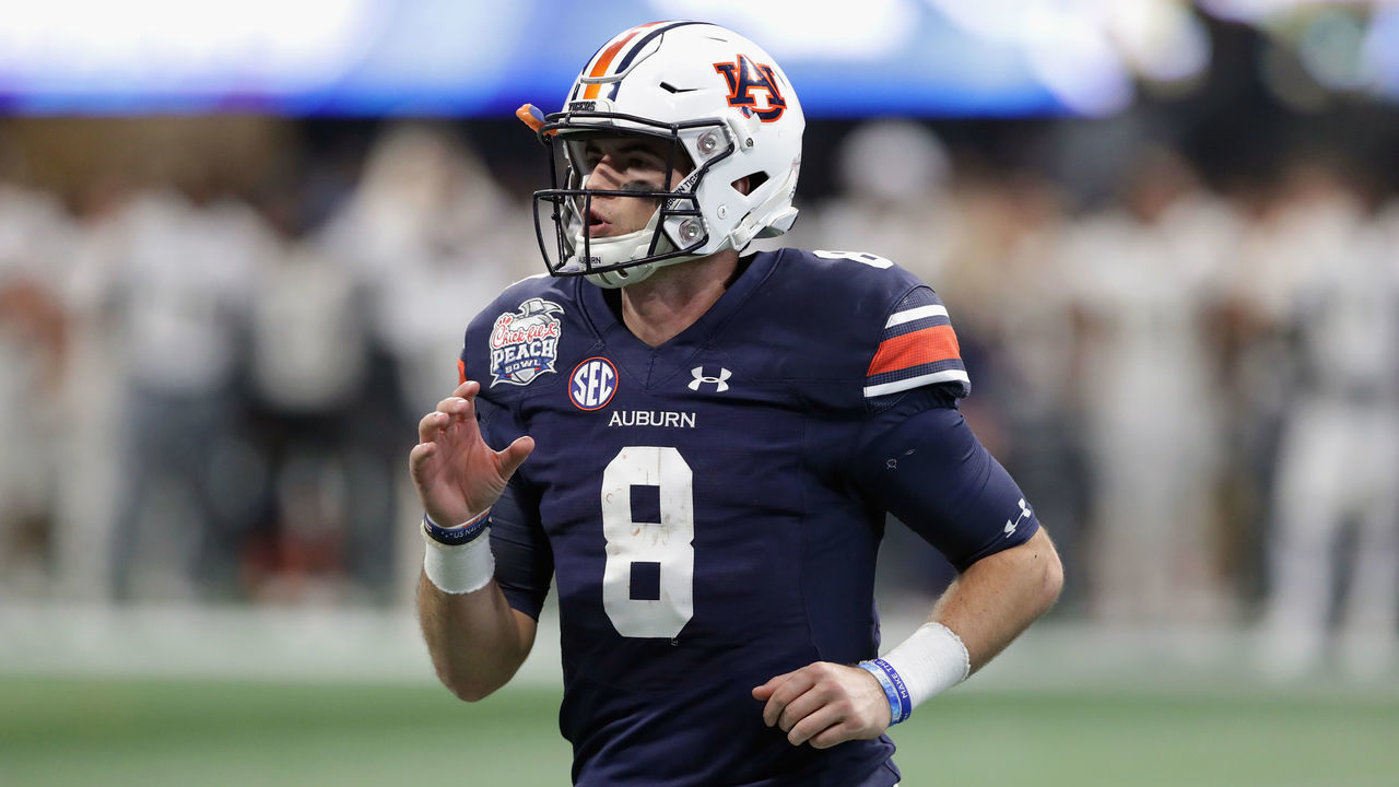 ATLANTA, GA - JANUARY 01: Jarrett Stidham #8 of the Auburn Tigers looks on in the first half against the UCF Knights during the Chick-fil-A Peach Bowl at Mercedes-Benz Stadium on January 1, 2018 in Atlanta, Georgia.