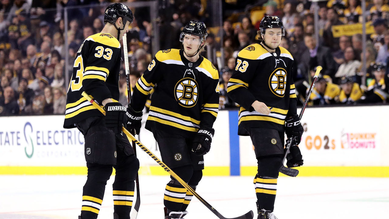 BOSTON, MA - APRIL 07: Zdeno Chara #33 of the Boston Bruins, Danton Heinen #43 and Charlie McAvoy #73 talk during the first period against the Ottawa Senators at TD Garden on April 7, 2018 in Boston, Massachusetts.
