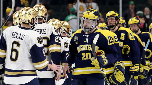 ST PAUL, MN - APRIL 05: Tory Dello #6 of the Notre Dame Fighting Irish and Cooper Marody #20 of the Michigan Wolverines shake hands after the game during the semifinals of the 2018 NCAA Division I Men's Hockey Championships on April 5, 2018 at Xcel Energy Center in St Paul, Minnesota.