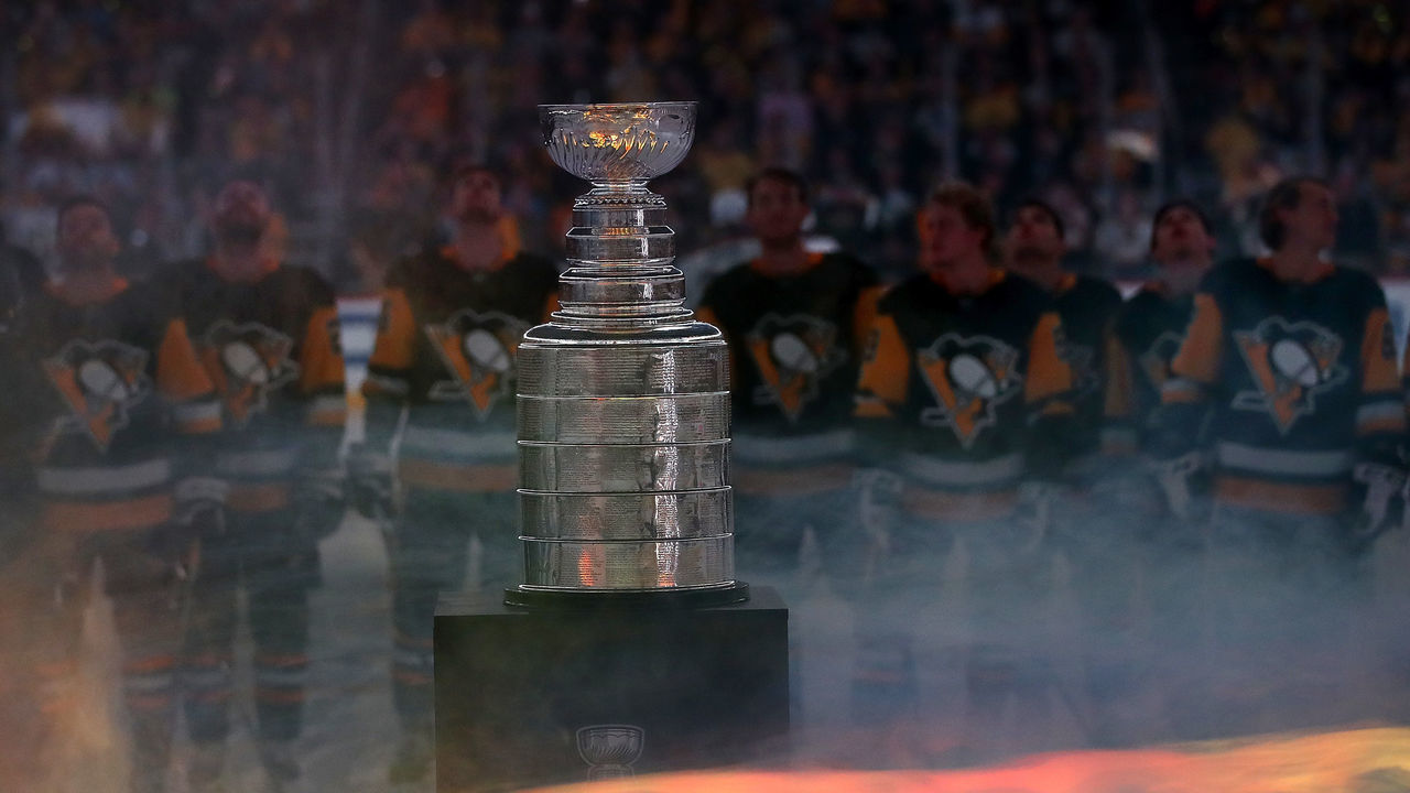 PITTSBURGH, PA - OCTOBER 04: The Pittsburgh Penguins watch their 2017 Stanley Cup Championship banner rise to the rafters behind the Stanley Cup prior to a game agains the St. Louis Blues at PPG PAINTS Arena on October 4, 2017 in Pittsburgh, Pennsylvania.